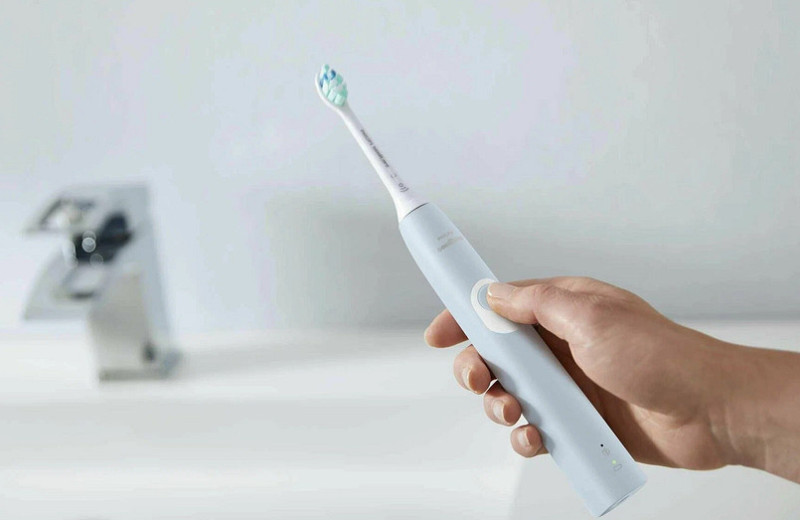 Как выбрать электрическую зубную щетку: виды, модели, особенности