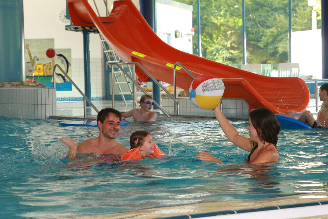 Family in a water pool