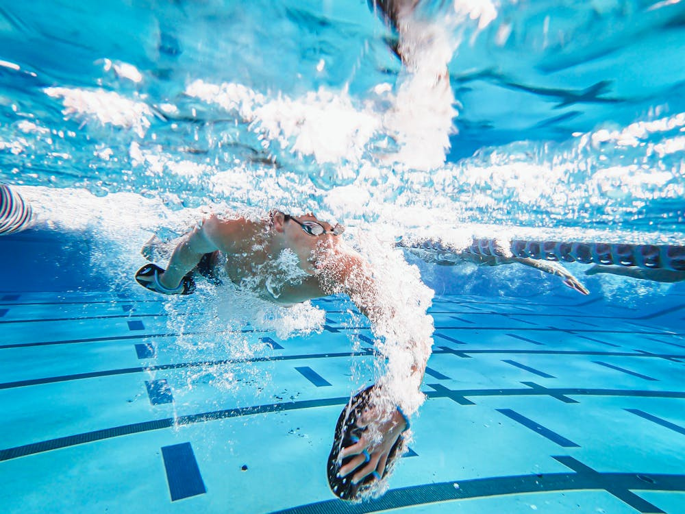 swimmer with paddles